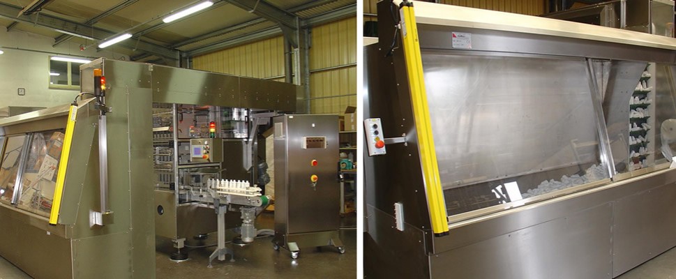 Machine in a Pharmaceutical environment with a secure hopper feed located outside the enclosure